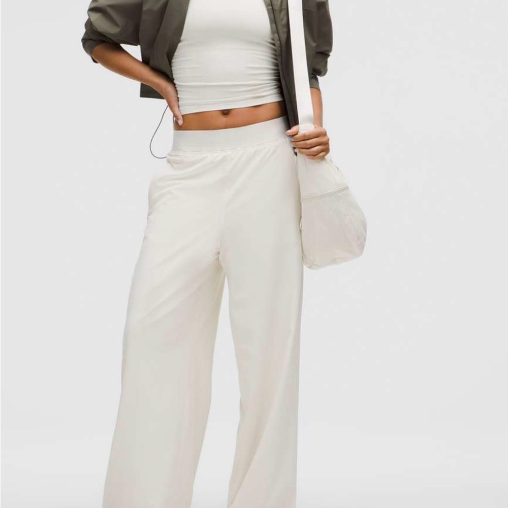 Lululemon Swift Wide Leg High rise Pant with Logo Waistband
Size L, Light ivory